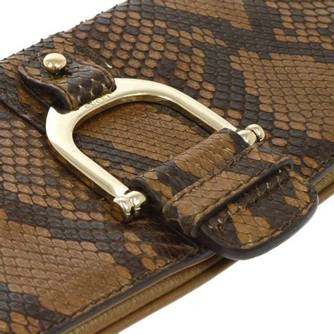 gucci black and gold clutch|Gucci snakeskin clutch.